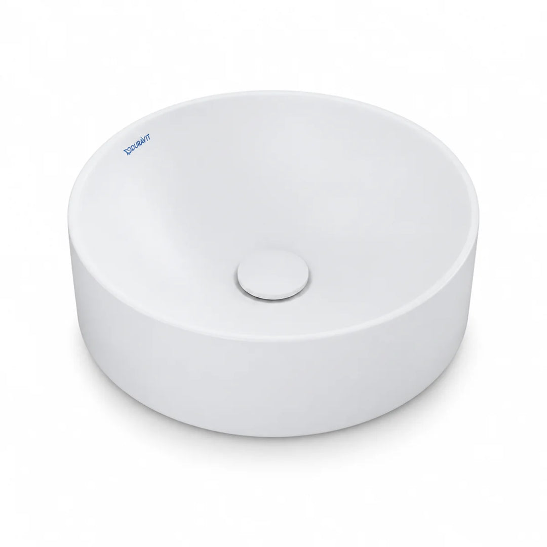 Duravit Durapoint round countertop washbowl in white matt, shown from above at an angle with a matching round waste cover
