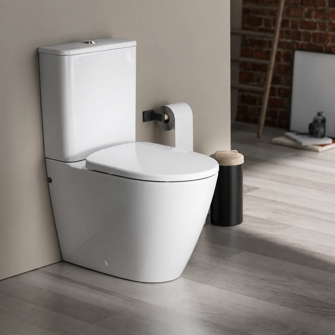 Geberit Smyle rimless close-coupled toilet in white, angled view installed in a neutral modern bathroom