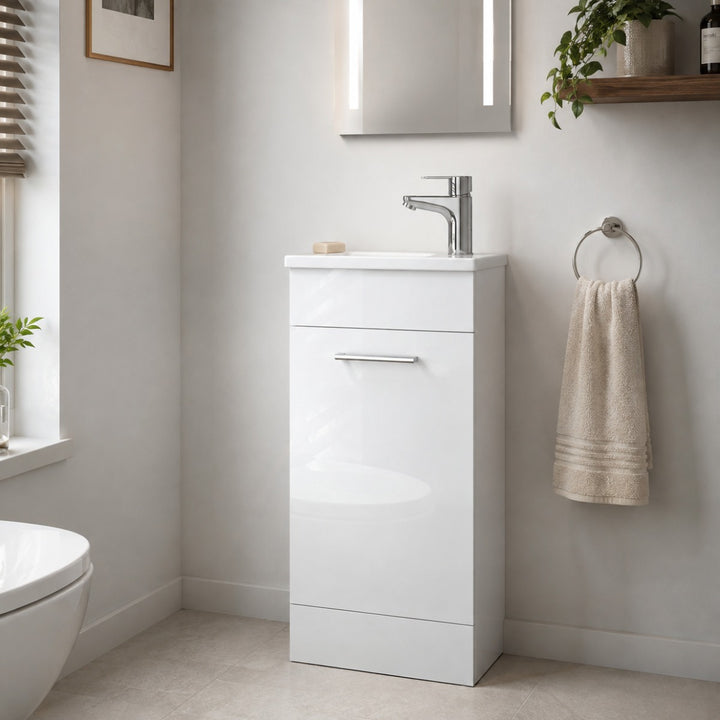 Vitra Mia 400mm white high gloss floor standing washbasin unit with integrated basin, single door and chrome handle.