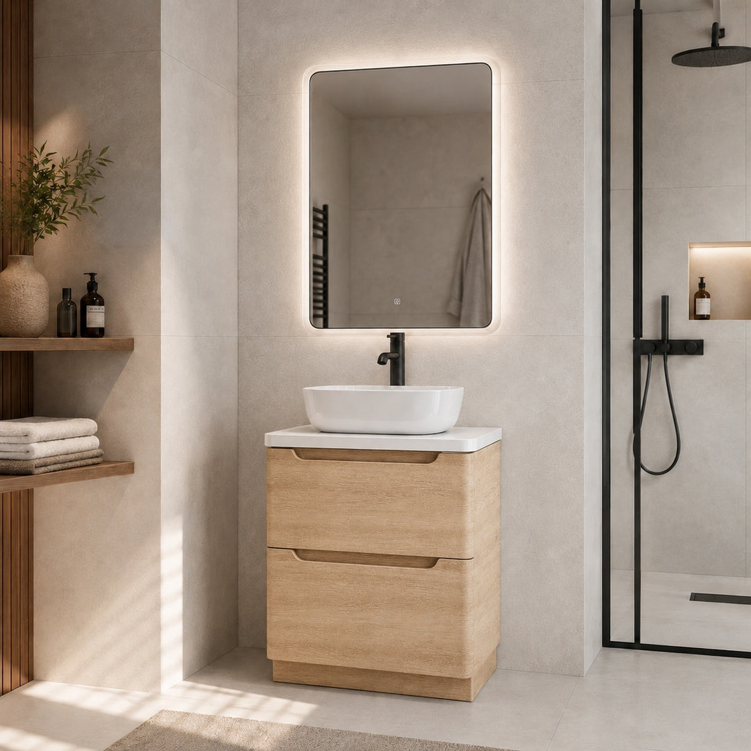 Camden 600mm floorstanding vanity unit with white worktop in Bardolino Oak in a modern bathroom.