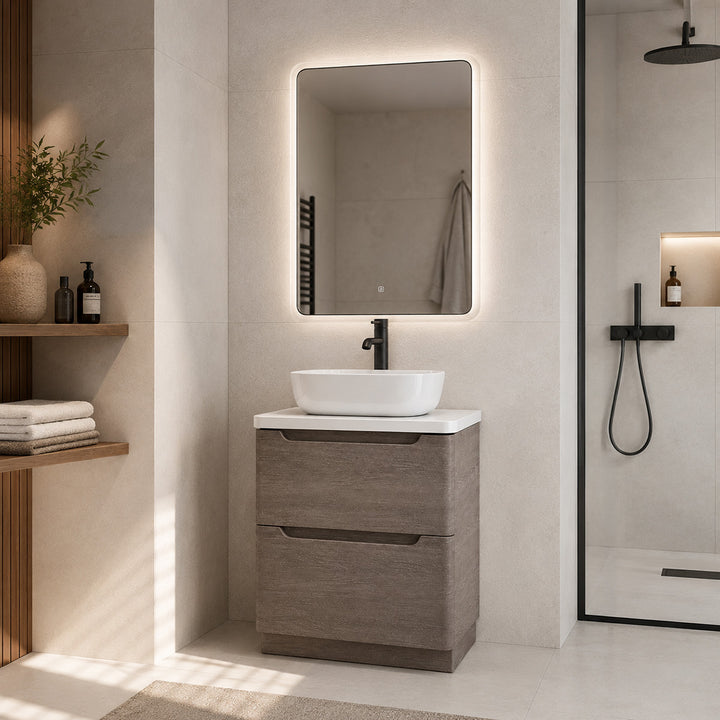 Camden 600mm floorstanding vanity unit with white worktop in Graphite Oak in a modern bathroom.