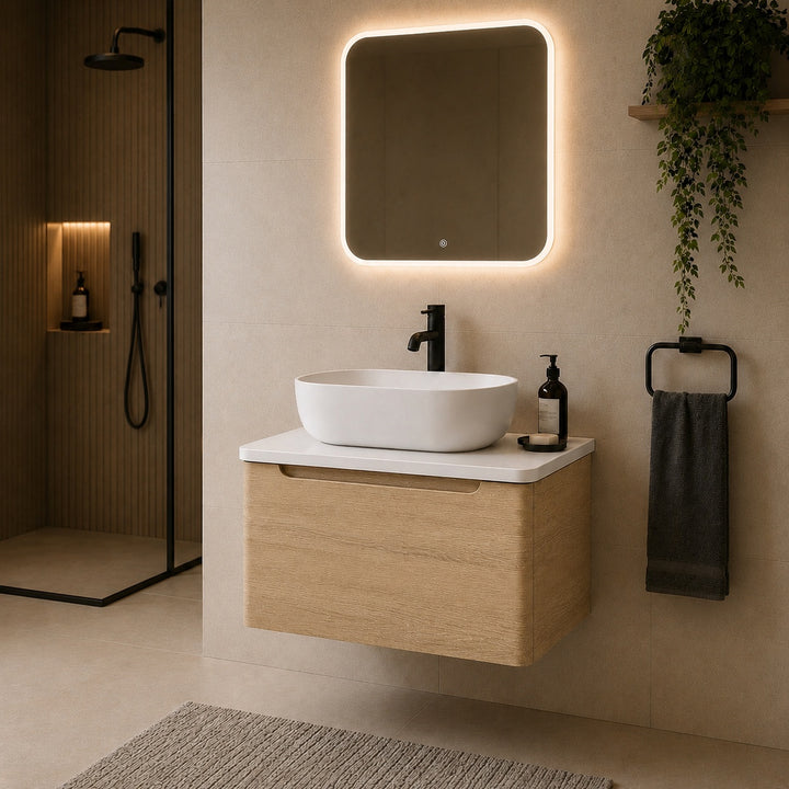 Camden 600mm wall hung vanity unit with white worktop in Bardolino Oak, featuring a white worktop in a contemporary bathroom.