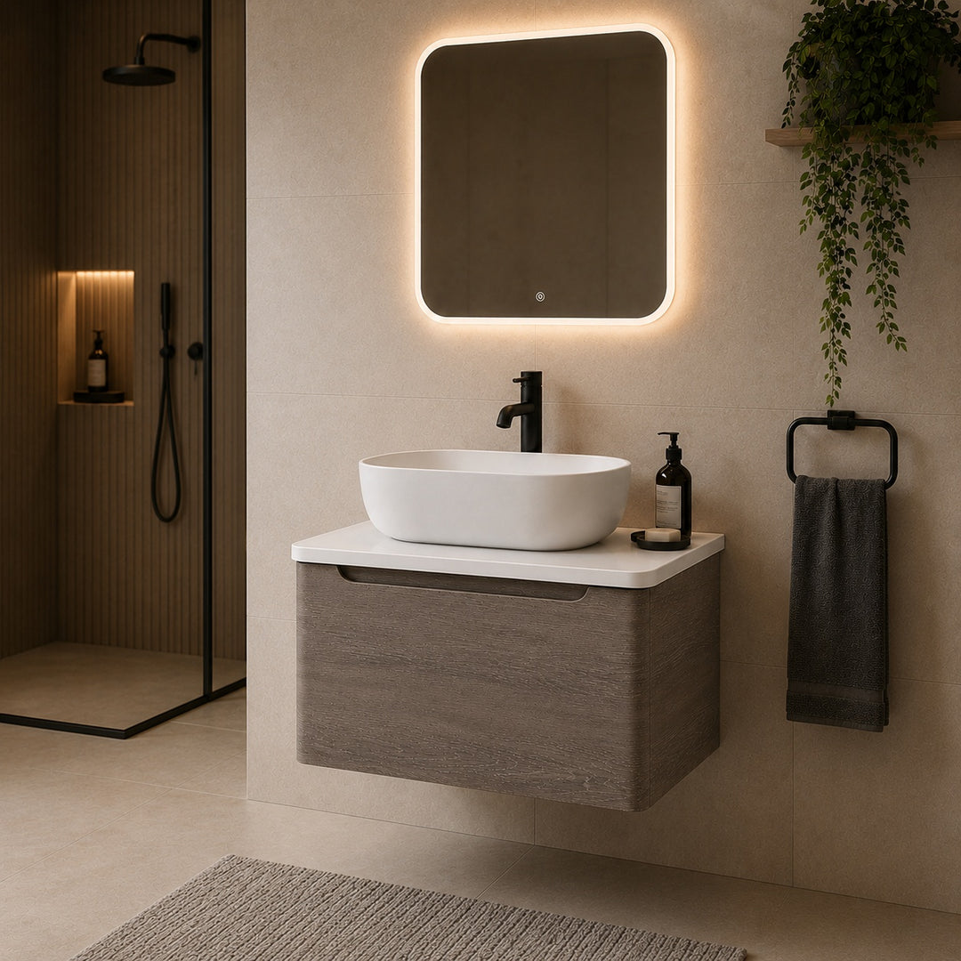 Camden 600mm wall hung vanity unit with white worktop in Graphite Oak, featuring a white worktop in a contemporary bathroom.