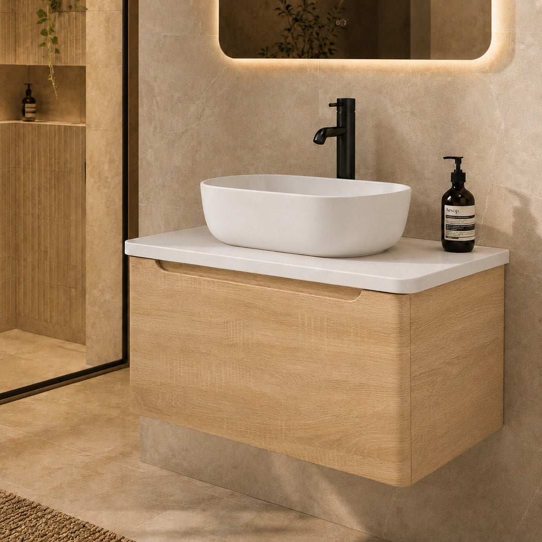 Camden 800mm wall hung vanity unit with white worktop in Bardolino Oak, featuring a white worktop in a contemporary bathroom.