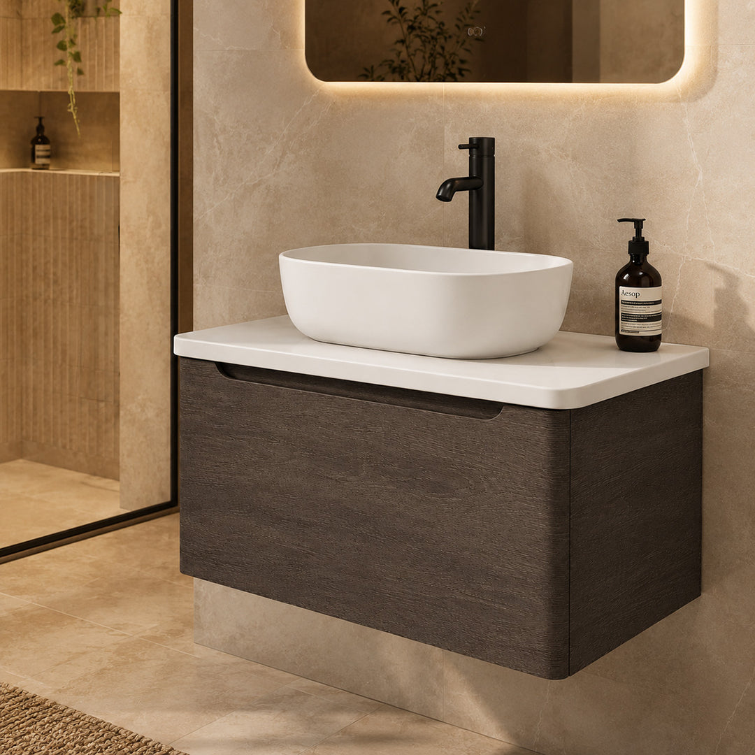 Camden 800mm wall hung vanity unit with white worktop in Graphite Oak, featuring a white worktop in a contemporary bathroom.