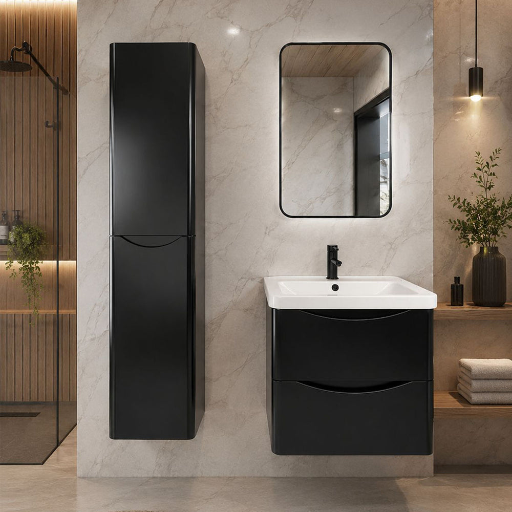 Modern bathroom with black vanity unit and tall cabinet.