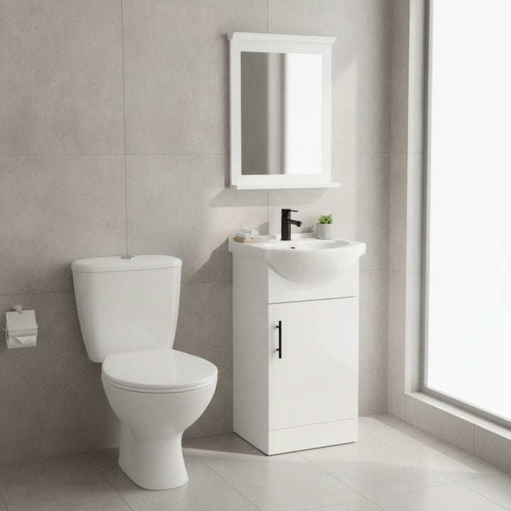 Vitra toilet and 450mm gloss white vanity unit pack with matching mirror, black basin mixer tap, black slotted basin waste and black bar handle, designed for modern bathrooms and cloakrooms.