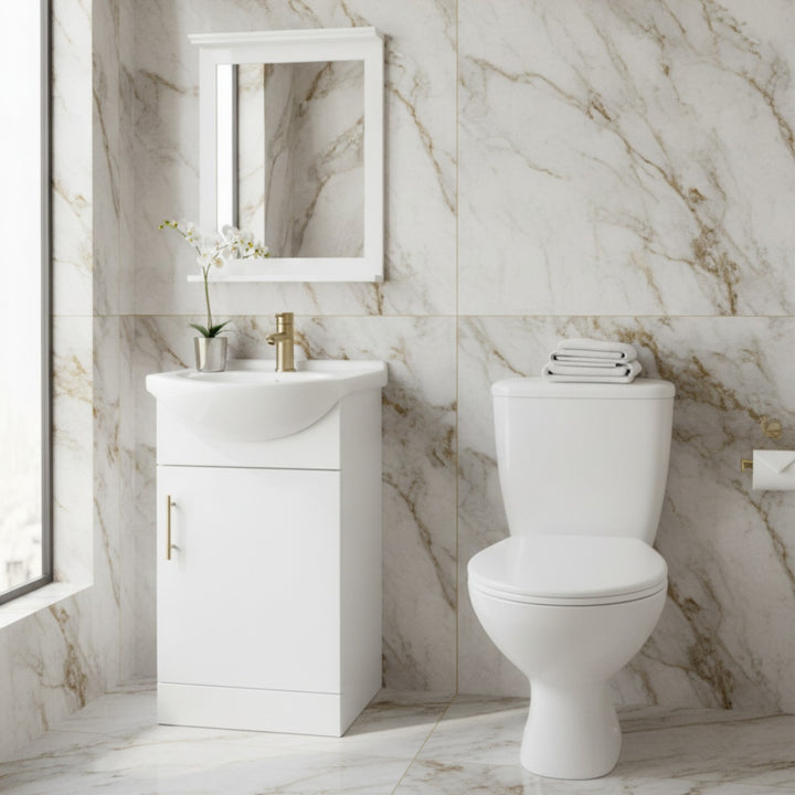 Vitra toilet and 450mm gloss white vanity unit pack with matching mirror and brushed brass accessories designed for modern bathrooms and cloakrooms.