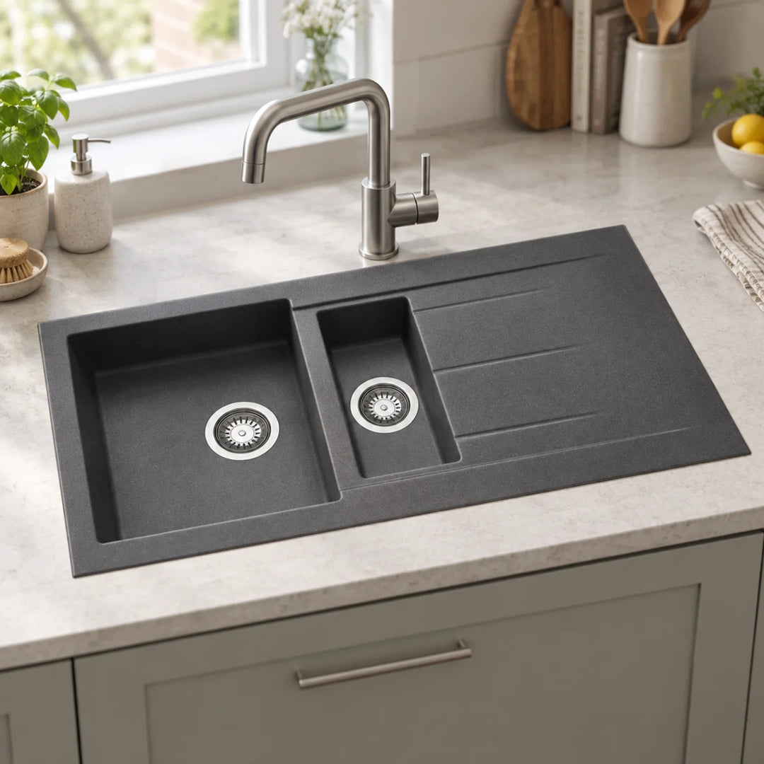 Prima+ Granite 1.5 bowl inset sink with drainer in gun metal, fitted in a light worktop with a brushed steel mixer tap
