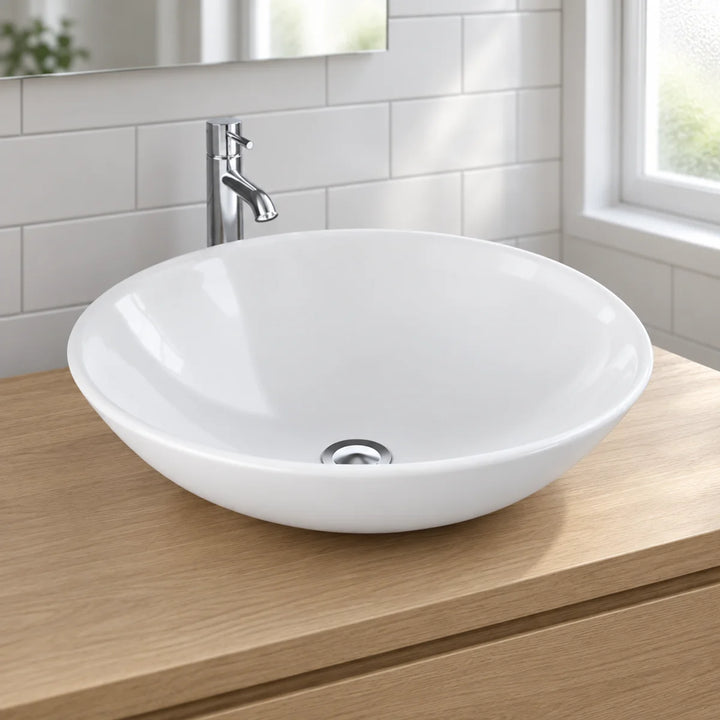 Diana 45cm white round bowl basin sitting on an oak vanity top with a tall chrome tap, against white metro tiles