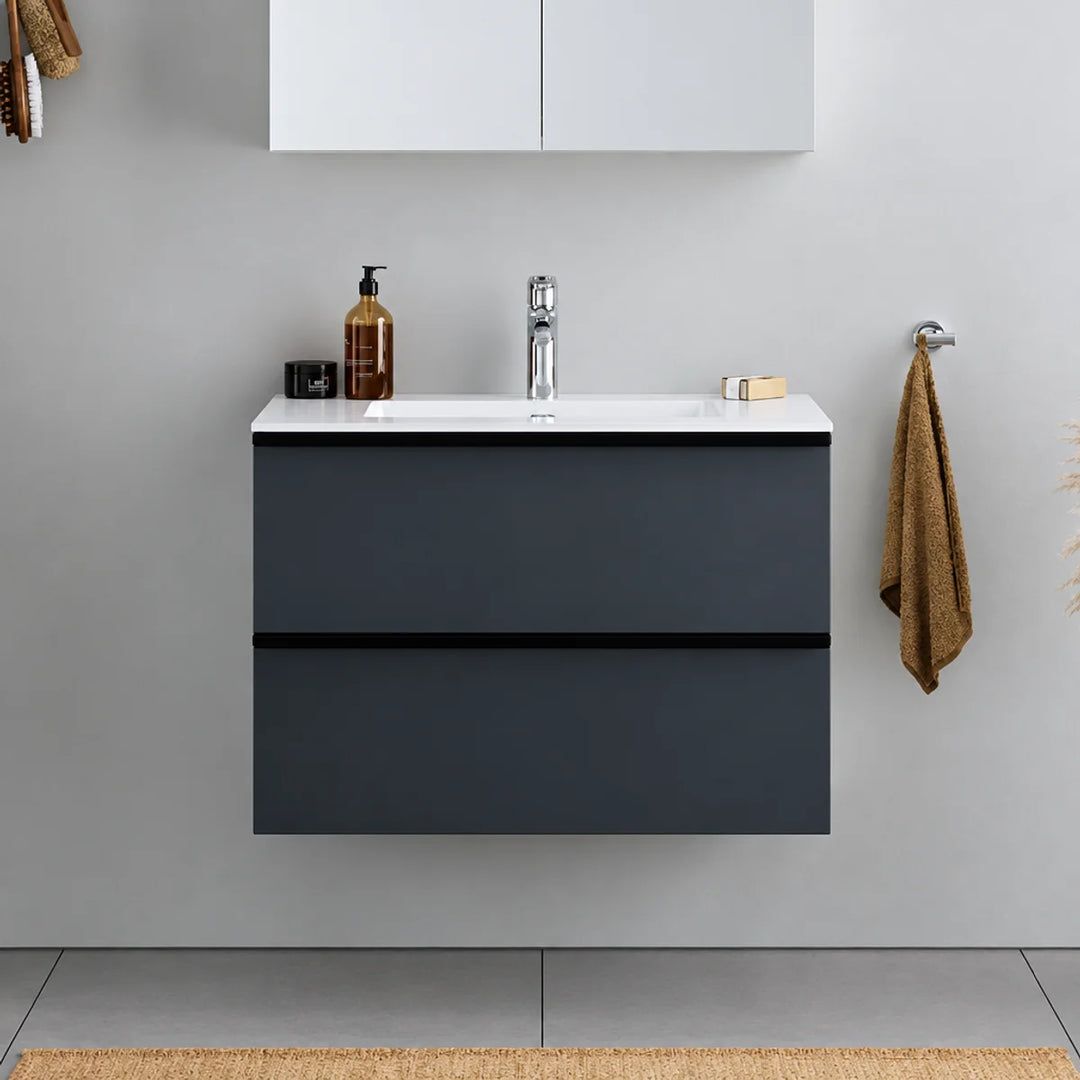 Duravit DuraPoint wall-mounted vanity unit in matt graphite with two drawers, white basin and chrome tap, shown in a grey bathroom