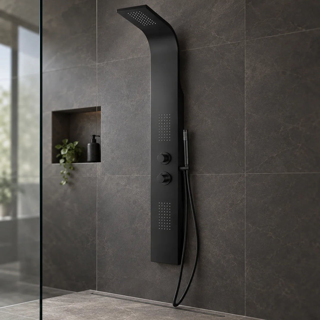 Eliseo Ricci Vesu black shower tower with two dials and handset, installed on dark stone-effect tiles in a walk-in shower