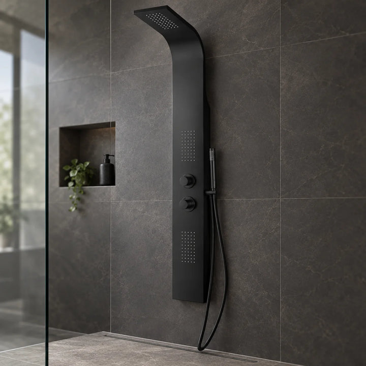 Eliseo Ricci Vesu black shower tower with two dials and handset, installed on dark stone-effect tiles in a walk-in shower