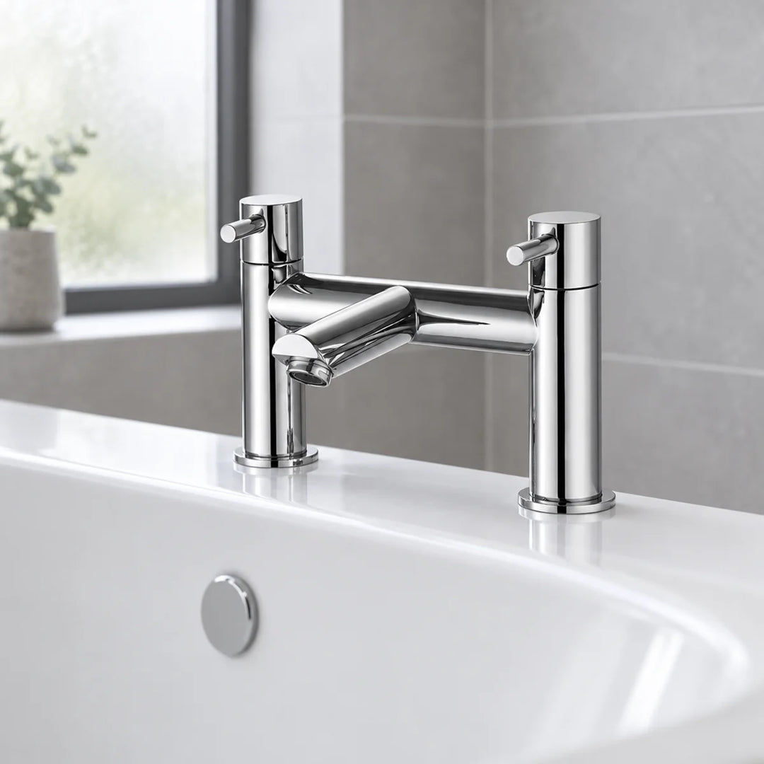 Eliseo Ricci Curve bath filler in chrome with two lever handles, shown installed on a white bath edge against grey tiles