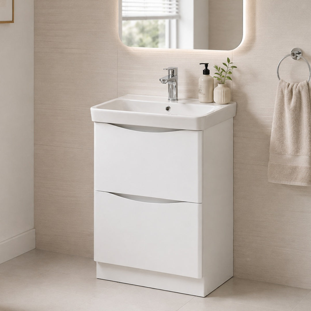 A modern white bathroom vanity unit with two drawers and an integrated rectangular sink.