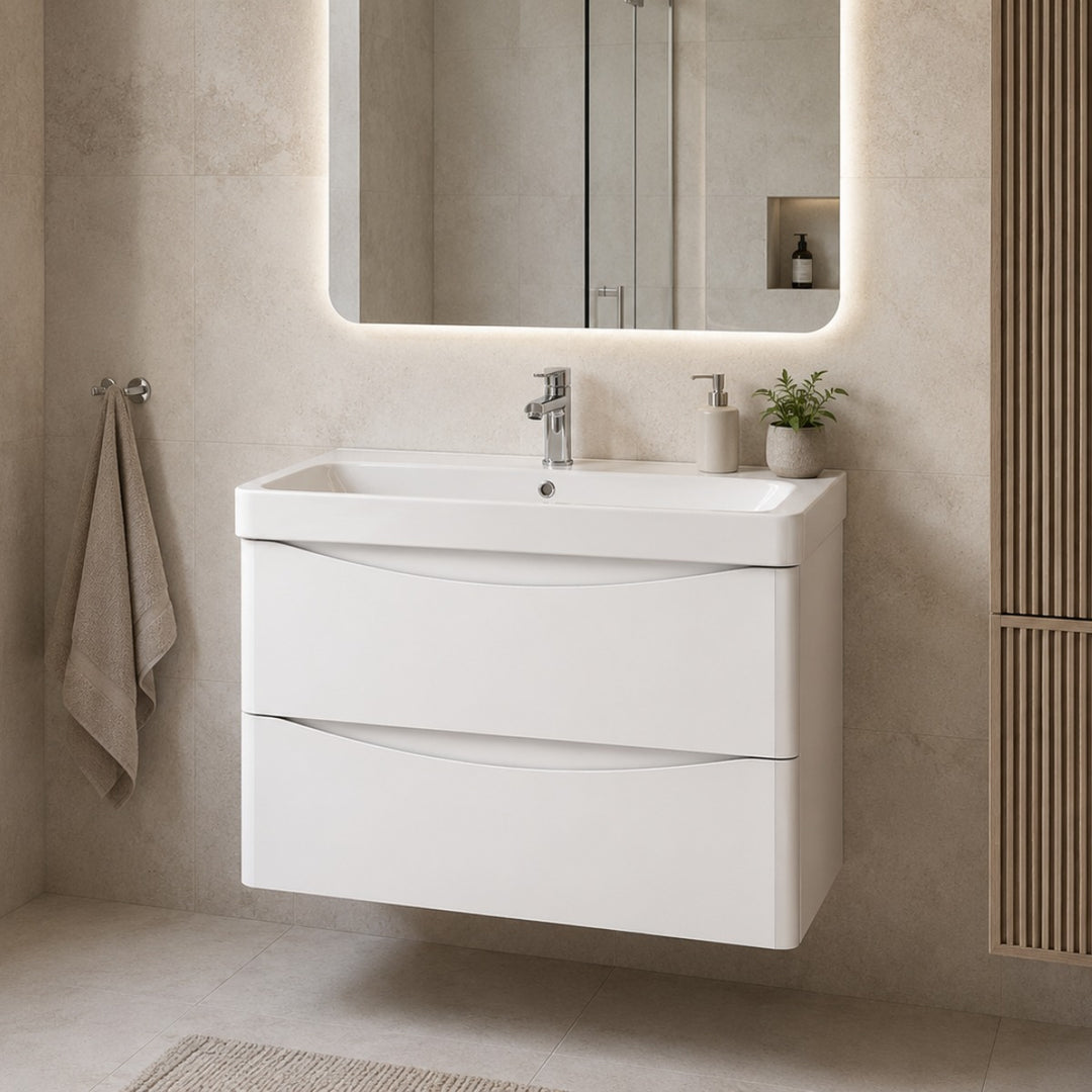 A modern white wall-mounted bathroom vanity with two drawers and integrated sink,.