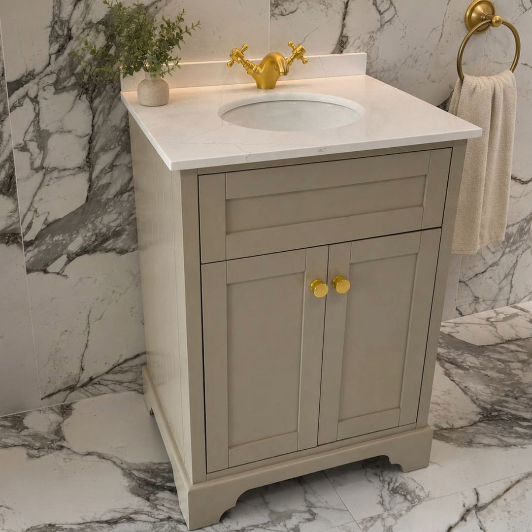 A classic floor standing 600mm bathroom vanity cabinet in a sand finished with a white marble countertop and white oval sink.