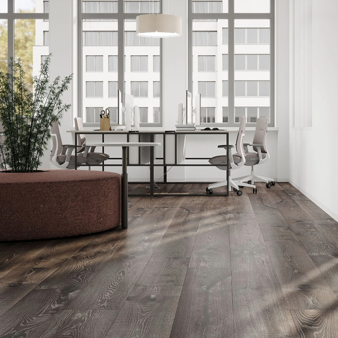 Ferry Oak 12mm laminate flooring with extra-long 2003 x 245mm wide planks, authentic oak grain detailing and natural brown tones.