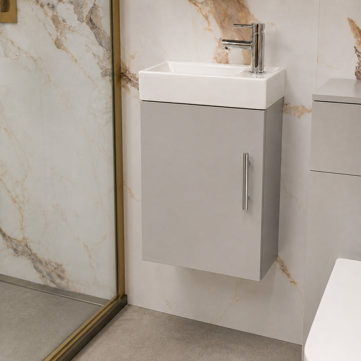 Mito 400mm wall-hung cloakroom vanity unit in pearl grey matt with compact ceramic basin, satin chrome knurled handle, chrome basin mixer tap and matching slotted basin waste.