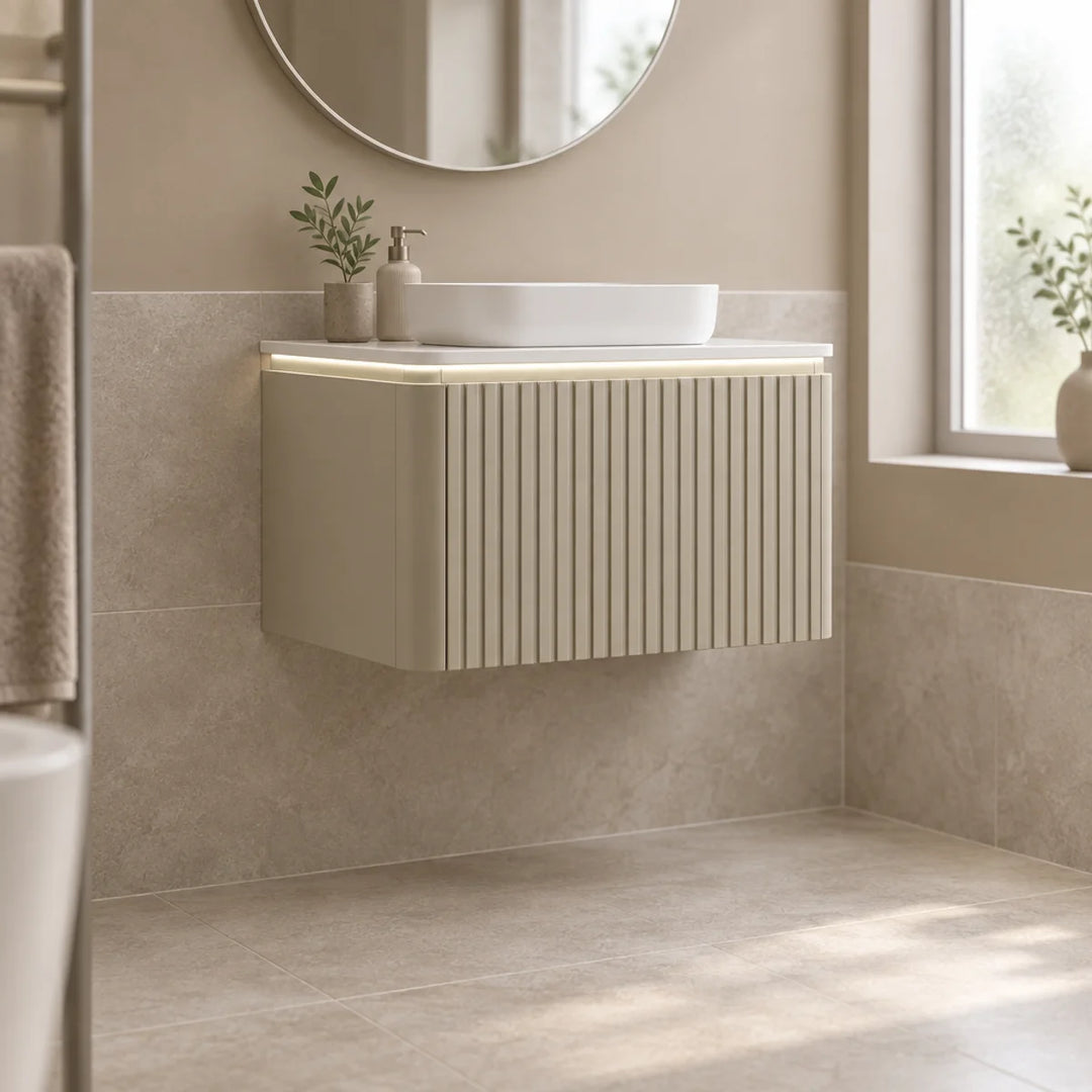 Monaco Matt Sand fluted wall mounted vanity unit with LED underlight and vessel basin in a neutral tiled bathroom