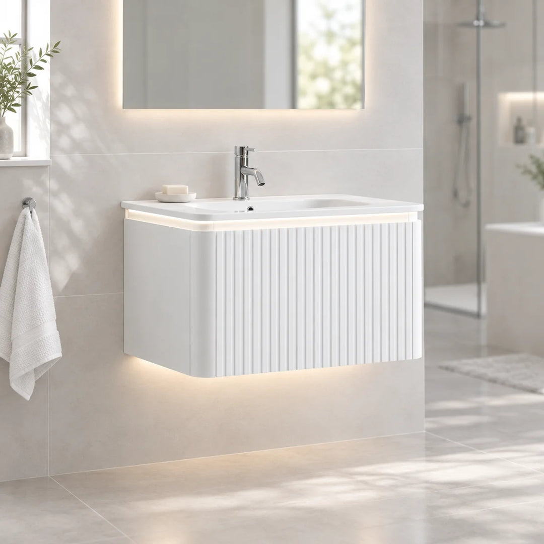 Monaco Matt White 800mm fluted wall mounted vanity unit with LED underlighting, shown installed in a bright modern bathroom