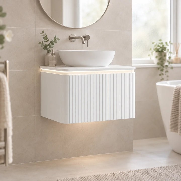 Monaco Matt White fluted wall hung vanity unit with LED underlighting, vessel basin, in a neutral beige bathroom