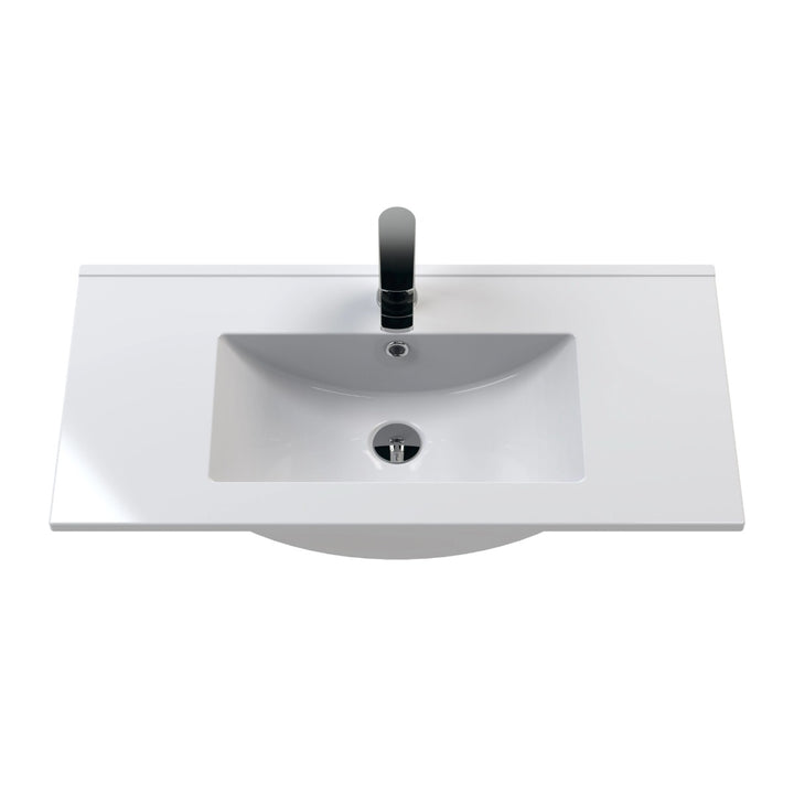 A modern white ceramic bathroom vanity sink with a rectangular basin.