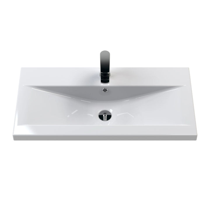 A modern white ceramic bathroom vanity sink with a rectangular basin.