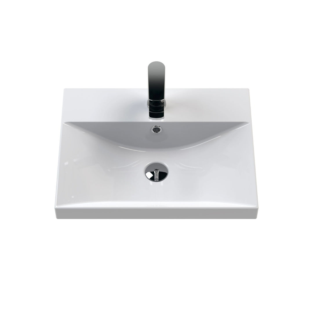 A modern white ceramic bathroom vanity sink with a rectangular basin.