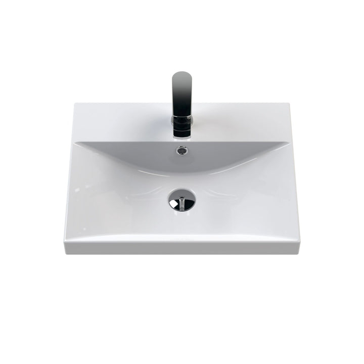 A modern white ceramic bathroom vanity sink with a rectangular basin.