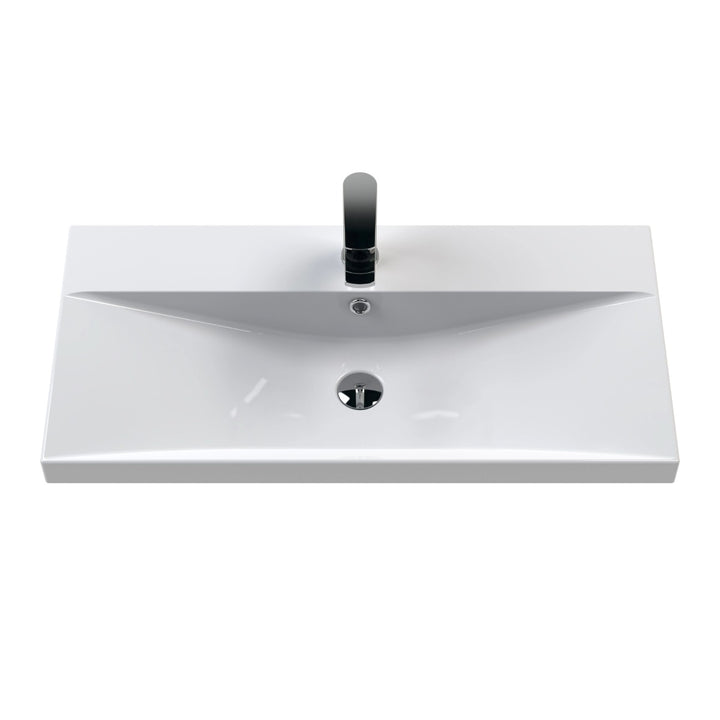 A modern white ceramic bathroom vanity sink with a rectangular basin.