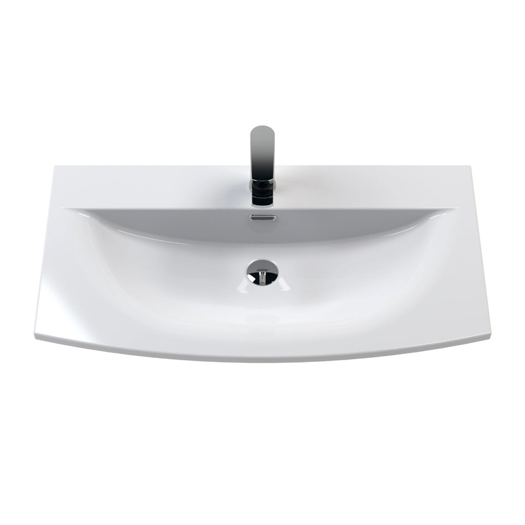 A modern white ceramic bathroom vanity sink with a bow front.