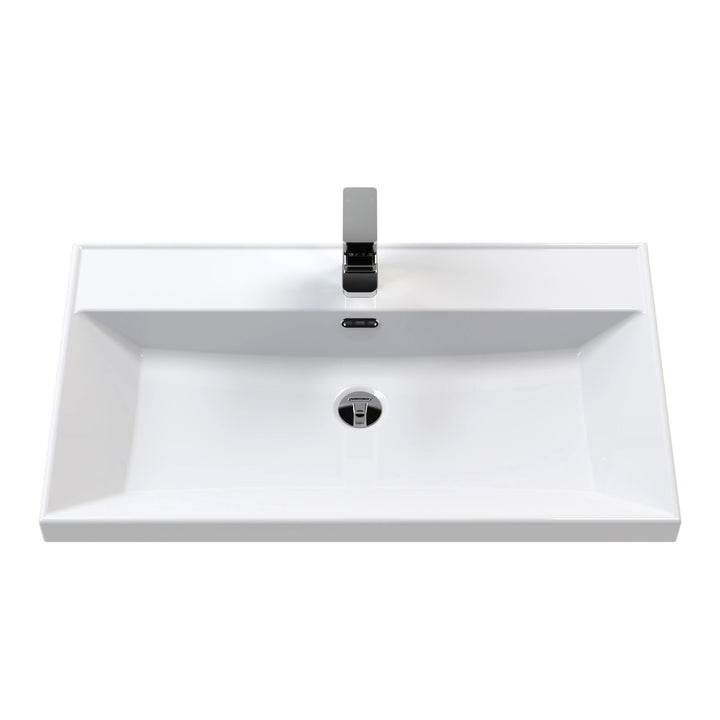 A modern white ceramic bathroom vanity sink with a rectangular basin.