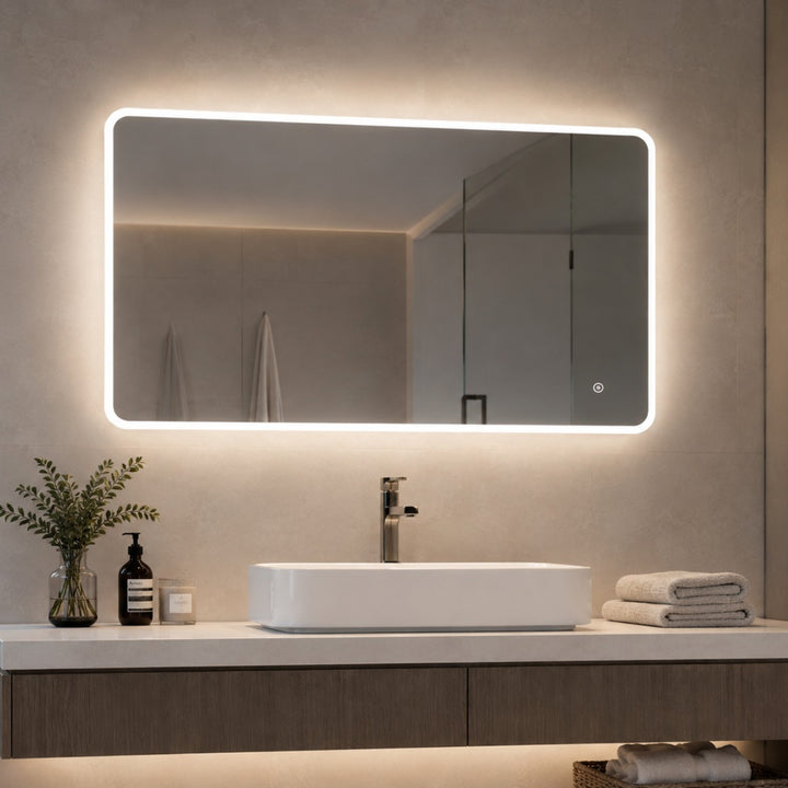 A modern rectangular LED-backlit bathroom mirror.