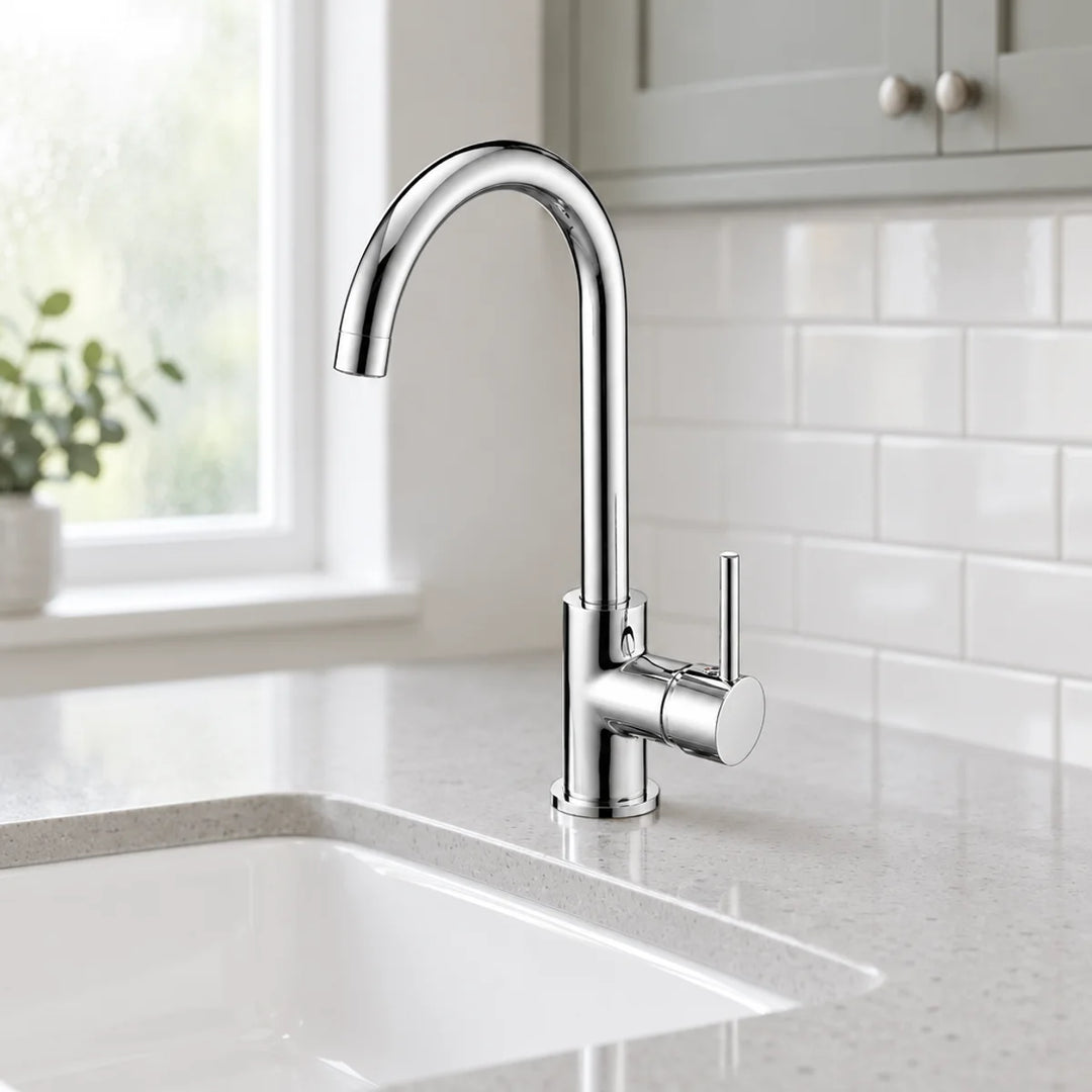 Tre Mercati Kitchener chrome mono sink mixer tap with curved spout and side lever, shown on a speckled worktop by a window