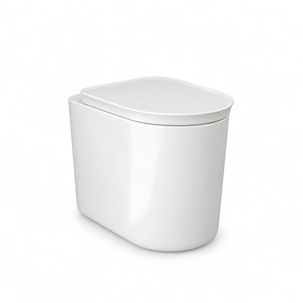 RAK Ceramics Valet soft close toilet seat in gloss white, closed over a matching rounded back to wall pan, three-quarter view