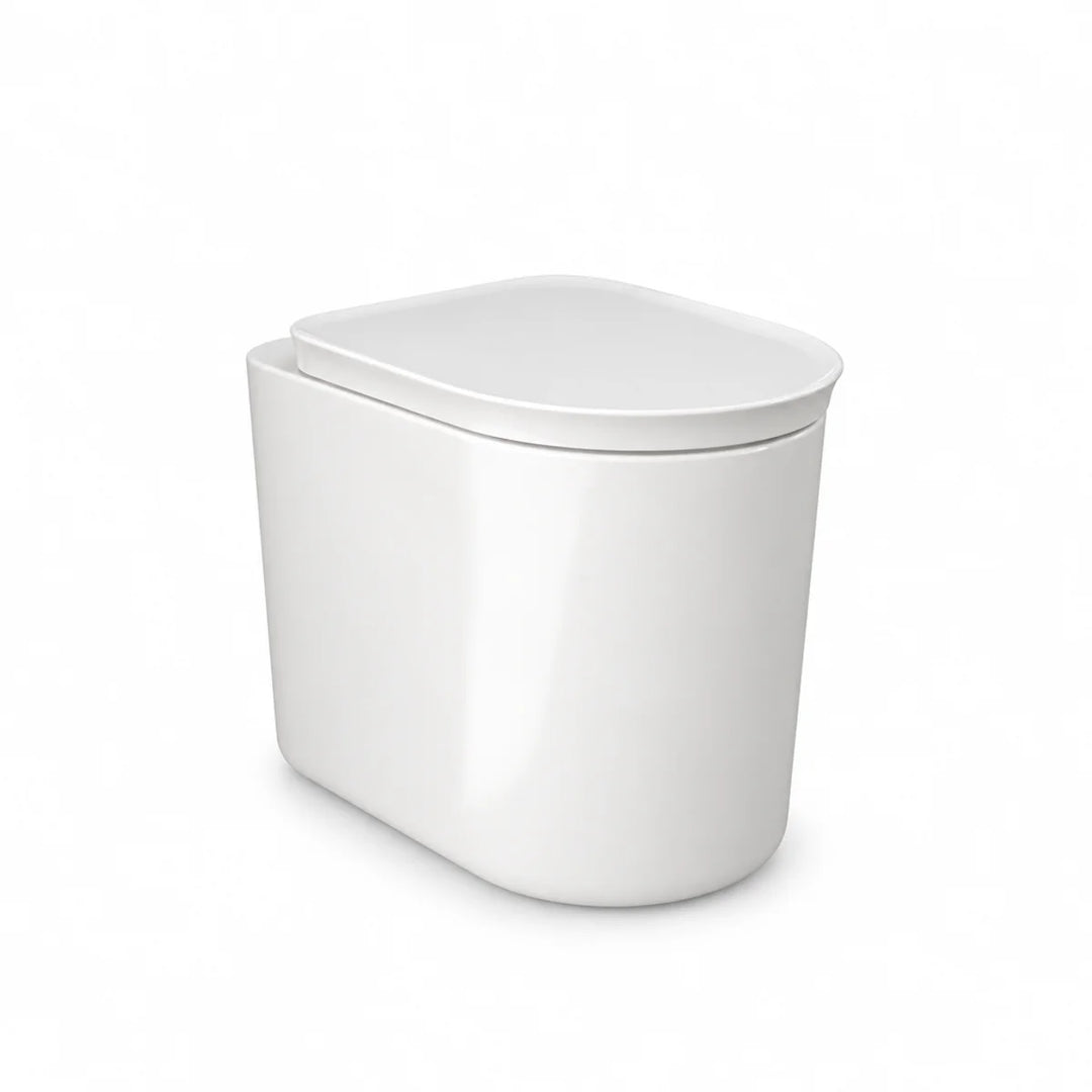 RAK Ceramics Valet soft close toilet seat in gloss white, closed over a matching rounded back to wall pan, three-quarter view