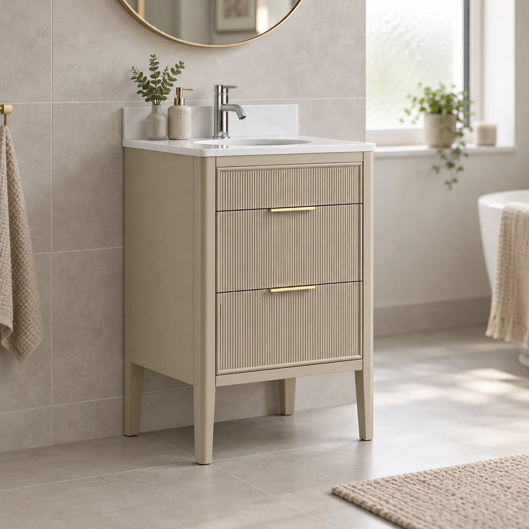Wilde Fluted 600mm vanity unit in sand with gold handles, white marble top and basin, styled in a neutral bathroom