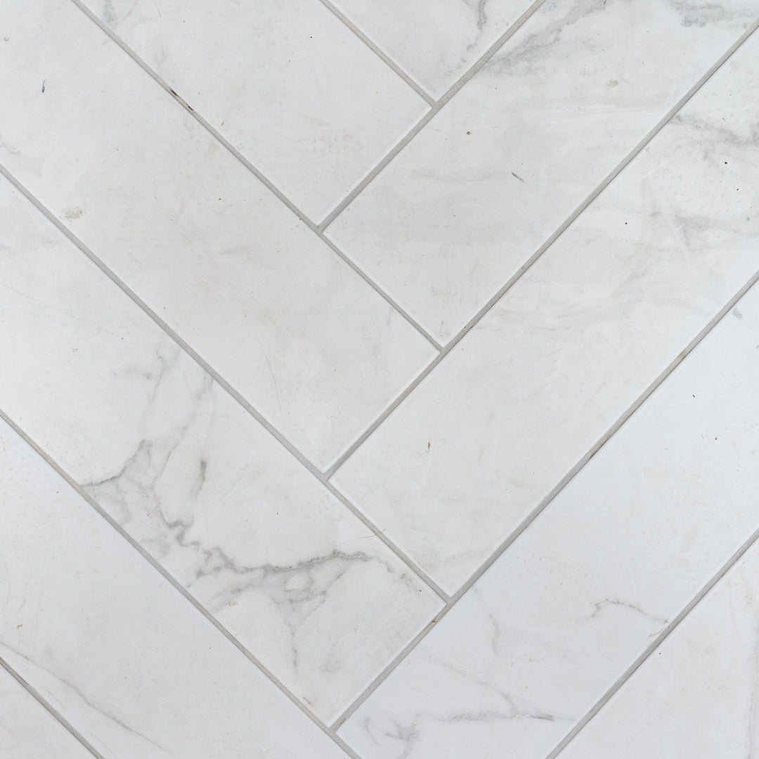 Dortmund Carrara Herringbone 9.9 x 49.2cm Porcelain Tile - 0.73sqm perbox
