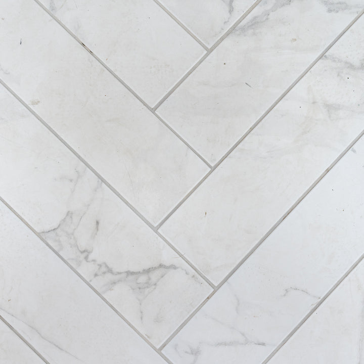Dortmund Carrara Herringbone 9.9 x 49.2cm Porcelain Tile - 0.73sqm perbox