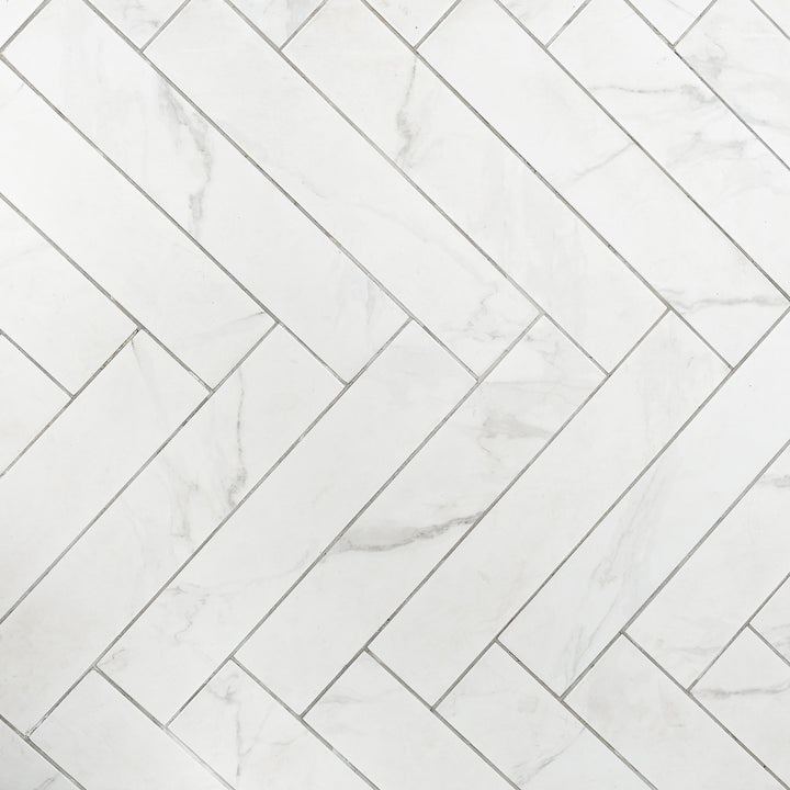 Dortmund Carrara Herringbone 9.9 x 49.2cm Porcelain Tile - 0.73sqm perbox