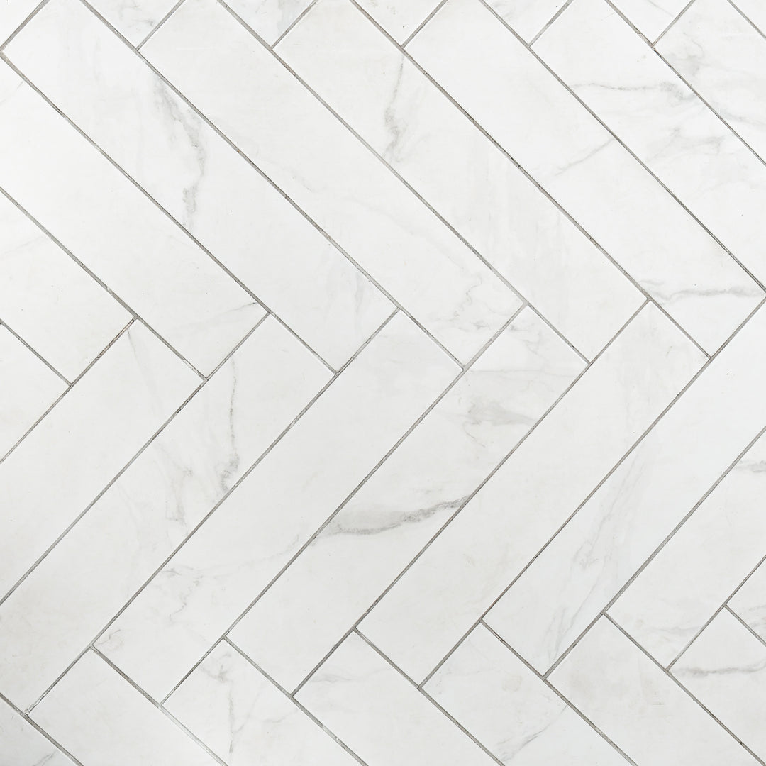 Dortmund Carrara Herringbone 9.9 x 49.2cm Porcelain Tile - 0.73sqm perbox