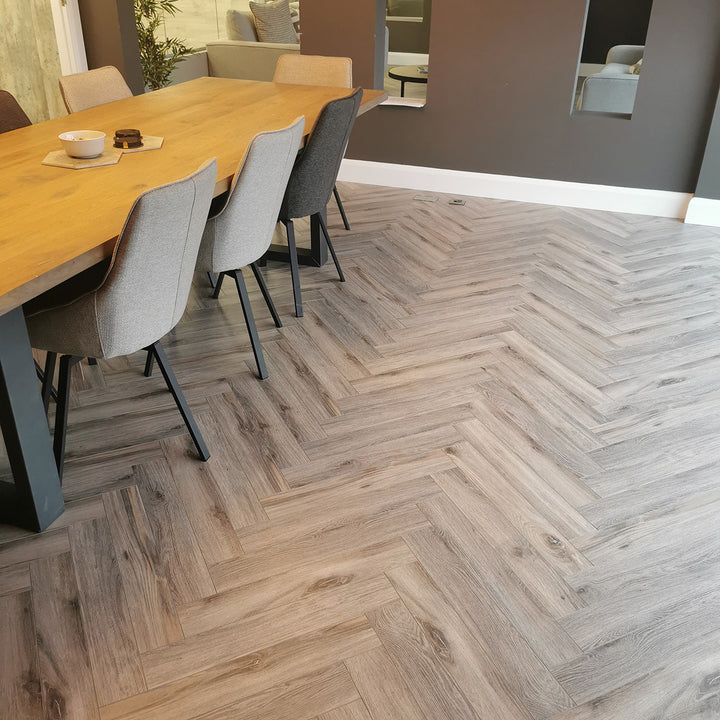 Volcanic Oak Herringbone 12mm Laminate Wooden Flooring - 1.92sqm per pack