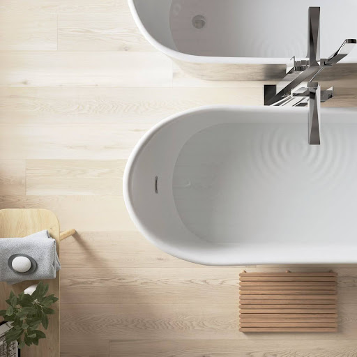 Birds eye view of a freestanding bath with wooden floors